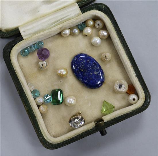 A small quantity of assorted mainly unmounted gemstones including a diamond.
